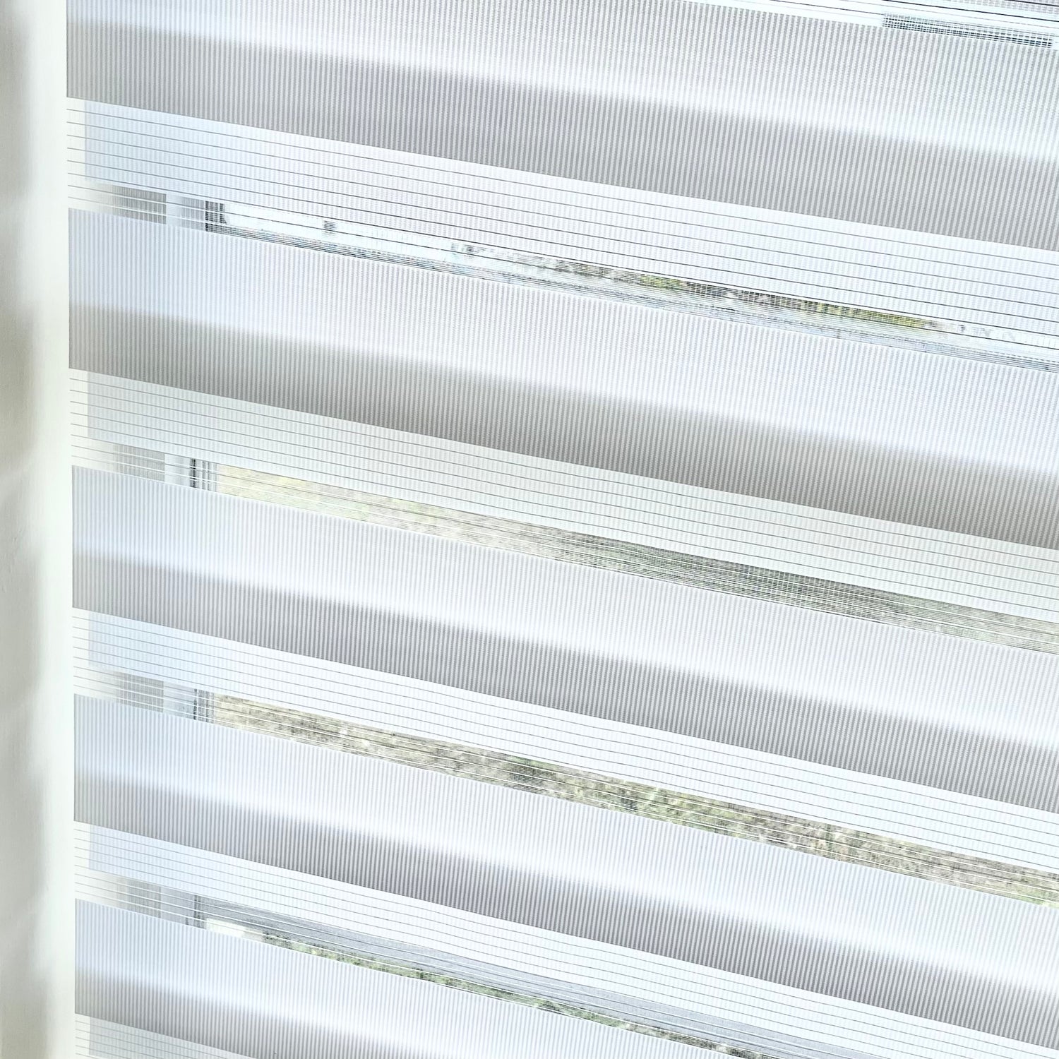 Create an airy atmosphere with this light yet durable fabric option. With its vibrant color pallet and a delicate sheer band, it will sure give your windows a trendy look. Plus it's super easy to clean and maintain – what a bonus!